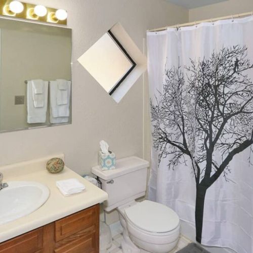 Main level bathroom with tub and shower.  Towels provided.