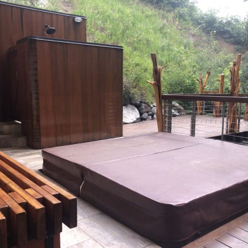 The Hot Tub is located up the your own private pathway across the stream on the adjacent property.  It has an outdoor shower.   Your privacy is always respected