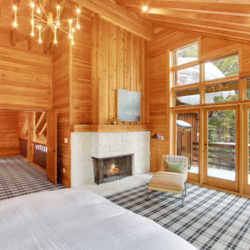 Master Suite - wood burning fireplace, deck and views of outside.