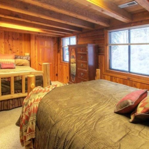 Ground level bedroom features double queens, two closets and dresser space.