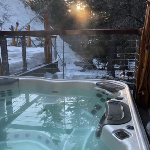 Enjoy unlimited access to the hot tub just across the stream from the Carriage House.