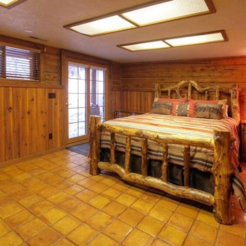 California King bed with access to hot tub and courtyard.